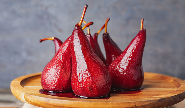 What is food poaching and what types of foods can be cooked using this technique?