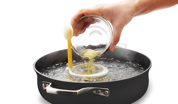 What is food poaching and what types of foods can be cooked using this technique?